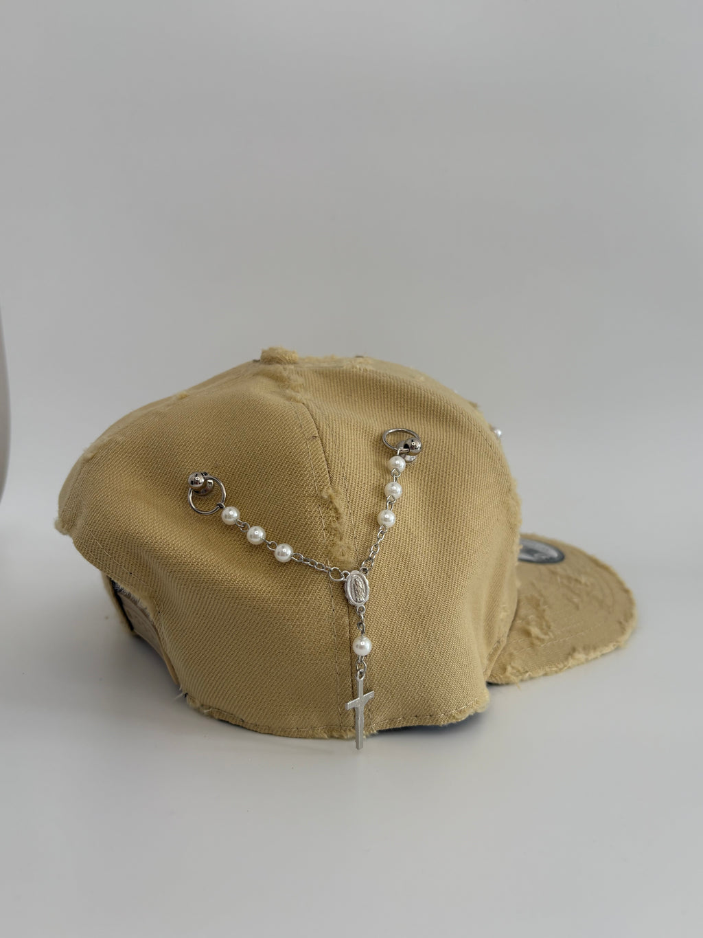Unique cap with a cross