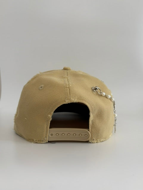 Unique cap with a cross